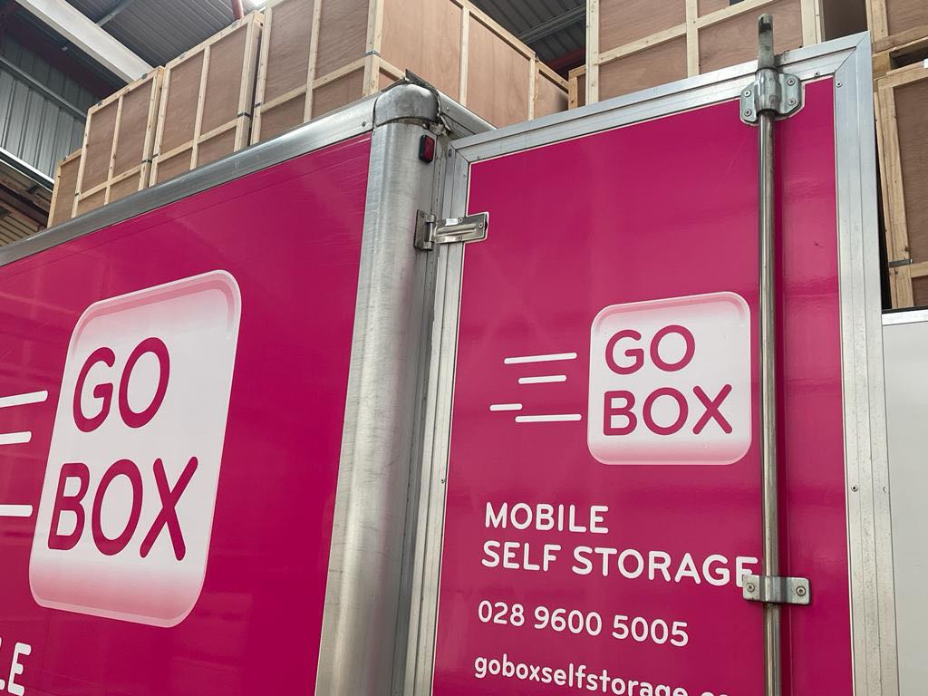 A pink mobile storage unit branded with the 